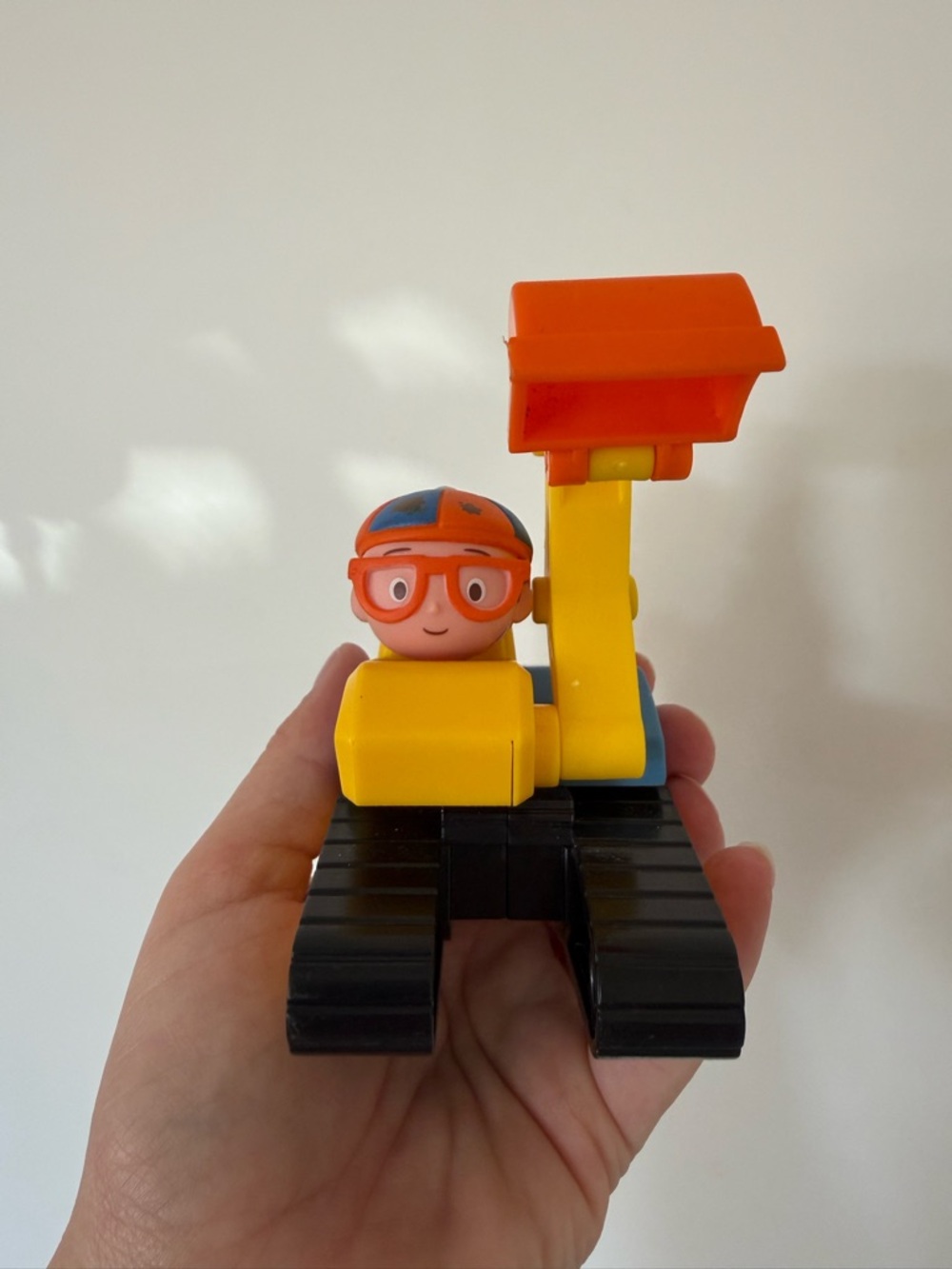 Bright Yellow and Orange Toy Excavator with Blippi